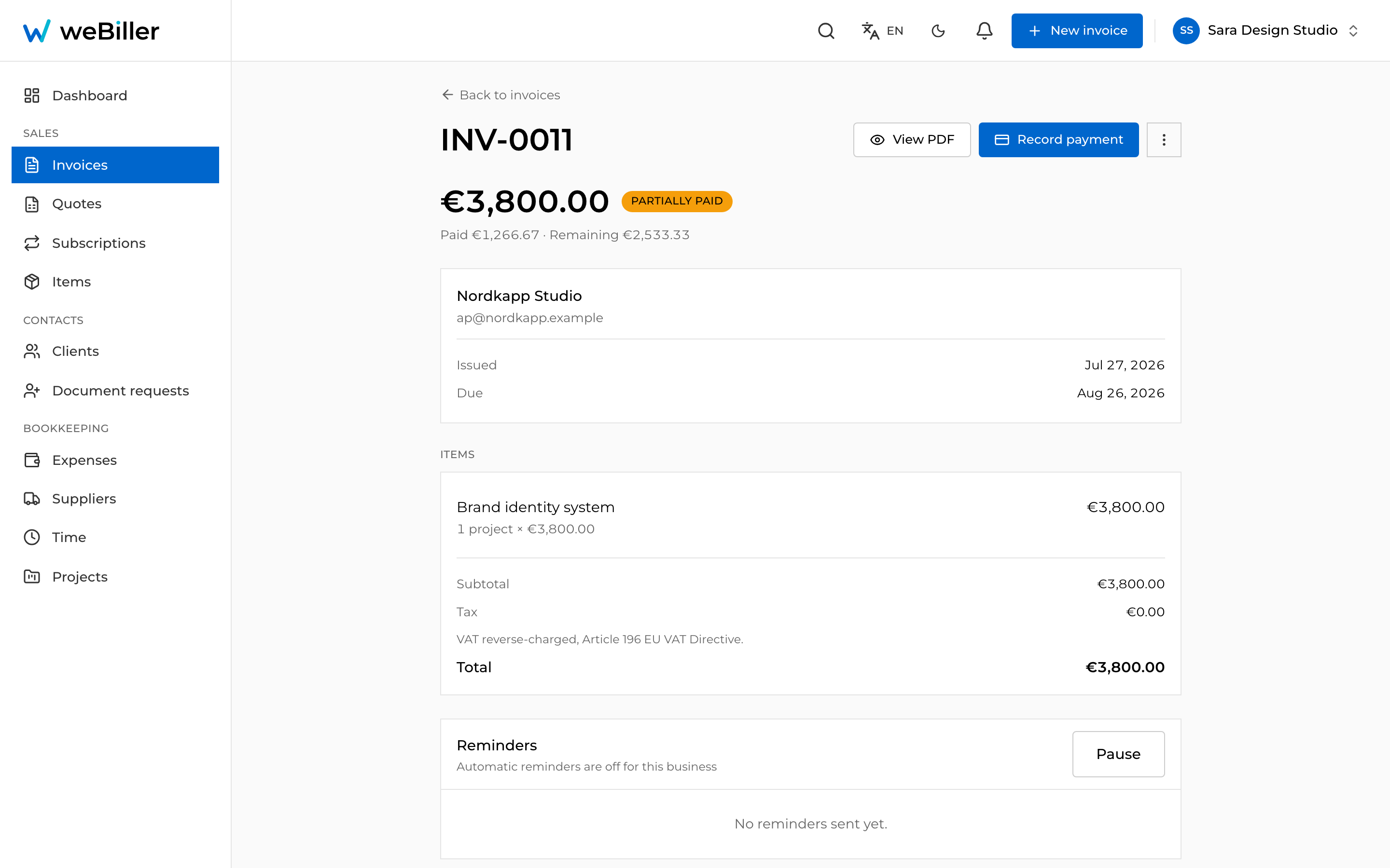 A euro invoice using the reverse-charge scheme, showing no VAT added and the reverse-charge note.